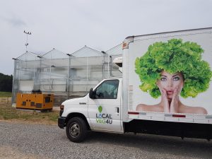 Local Vegetable Co truck and greenhouse